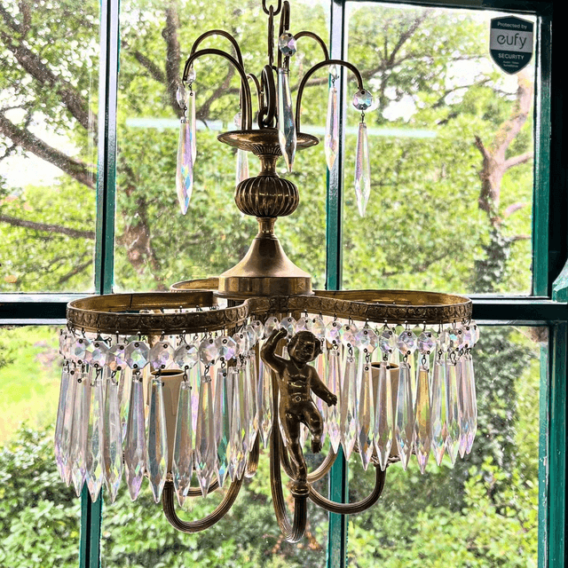 A 20th Century Three Stem Chandelier Adorned With Cherubs & Glass Crystals