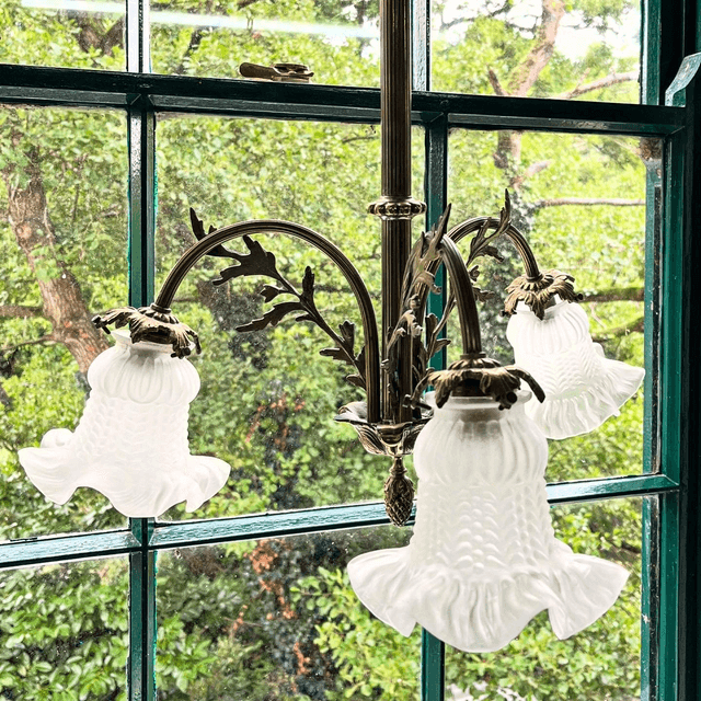A 19th Century Brass Three Arm Chandelier With French Tulip Glass Shades