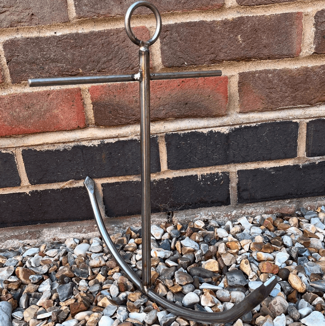 A Stainless Steel Decorative Sculpture Of An Anchor 