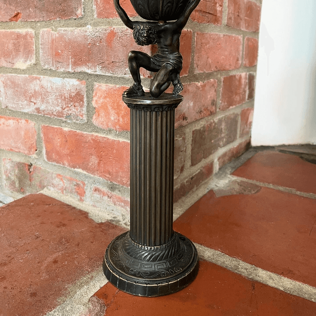 A Bronzed Metal Table Lamp Of Atlas