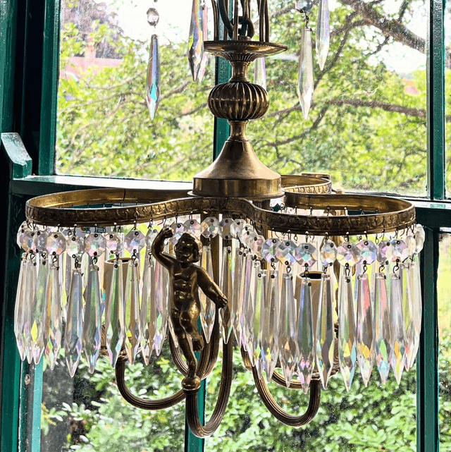 A 20th Century Three Stem Chandelier Adorned With Cherubs & Glass Crystals