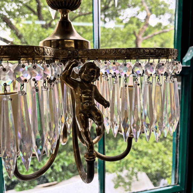 A 20th Century Three Stem Chandelier Adorned With Cherubs & Glass Crystals
