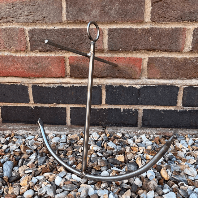 A Stainless Steel Decorative Sculpture Of An Anchor 