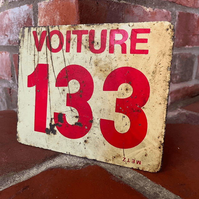 A French SNCF Railway Sign reading ‘Voiture 133’ which translates to ‘Car’ or ‘Carriage’ ’133’ for the City of Tourcoing in Northern France