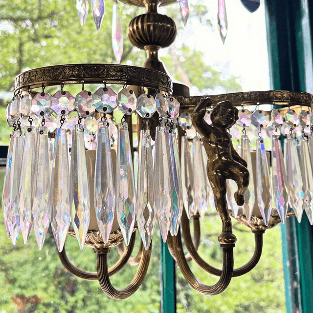 A 20th Century Three Stem Chandelier Adorned With Cherubs & Glass Crystals