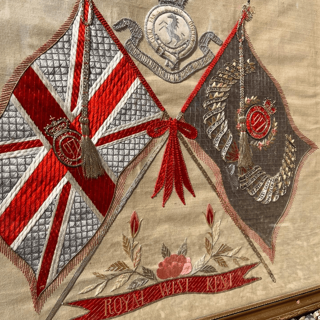 A Framed, Embroidered Silk Piece Depicting The Regimental Colours And Badge Of The Royal West Kent Regiment