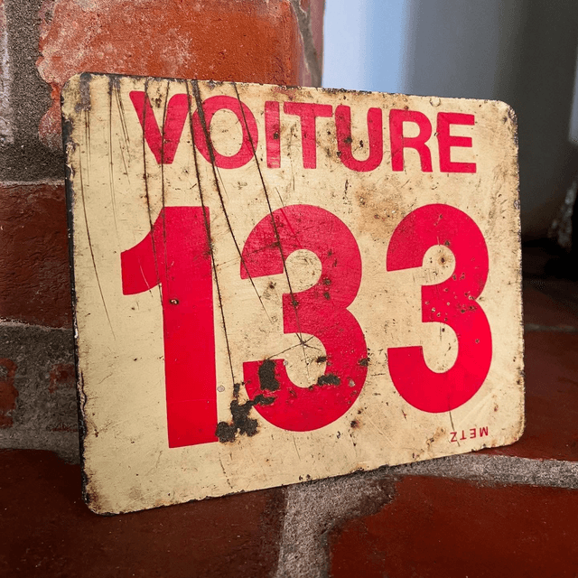 A French SNCF Railway Sign reading ‘Voiture 133’ which translates to ‘Car’ or ‘Carriage’ ’133’ for the City of Tourcoing in Northern France