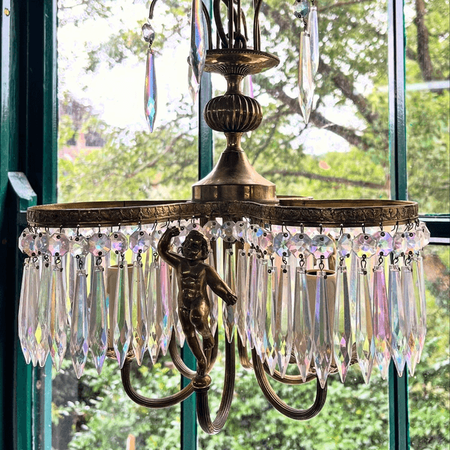 A 20th Century Three Stem Chandelier Adorned With Cherubs & Glass Crystals