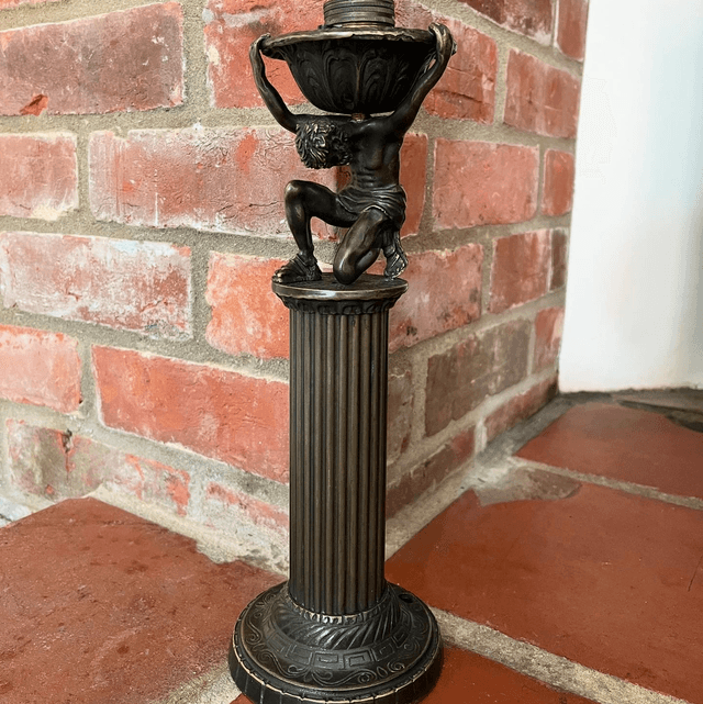 A Bronzed Metal Table Lamp Of Atlas